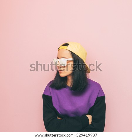 lady in a cap and sweater. the style of the 90's. winter fashion. new collection. minimalism.