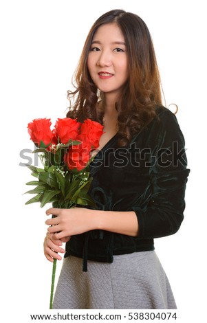 https://thumb1.shutterstock.com/display_pic_with_logo/3175751/538304074/stock-photo-young-happy-asian-woman-holding-red-roses-ready-for-valentine-s-day-538304074.jpg