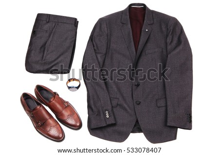 men's gray suit with a red golf , brown leather shoes and wristwatch. Stylish office look. All objects are isolated on white background