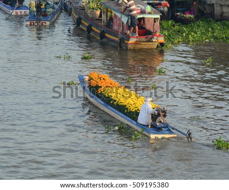 Soc Trang, Vietnam - Feb 2, 2016. People control motorboats on Nga Nam floating market in Soc Trang, southern Vietnam. Nga Nam is the local market of Mekong Delta, Vietnam