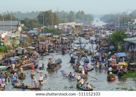 Soc Trang, Vietnam - Feb 2, 2016. People with wooden boats on Nga Nam floating market in Soc Trang, southern Vietnam.