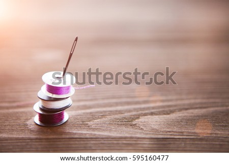 Close up of sewing items on wood background, tailoring theme
