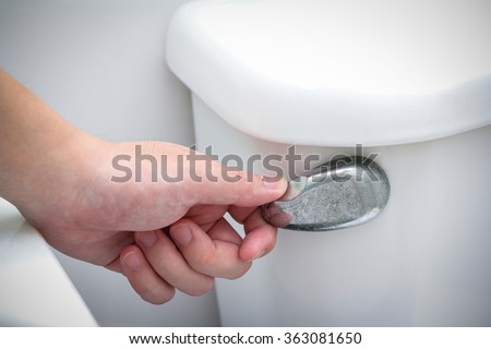 stock-photo-hand-flush-toilet-363081650.