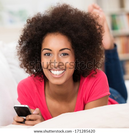 https://thumb1.shutterstock.com/display_pic_with_logo/321598/171285620/stock-photo-beautiful-young-african-american-woman-with-a-lovely-warm-smile-and-a-wild-afro-hairstyle-lying-on-171285620.jpg