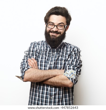 stock-photo-closeup-portrait-of-young-succesful-bearded-hipster-man-with-shirt-and-glasses-over-a-white-447852643.jpg