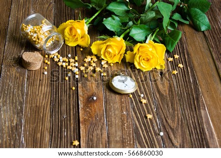 The bouquet of beautiful fresh yellow roses lies on a wooden table.
Card template by St. Valentine's Day or the international Women's Day.