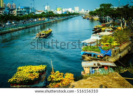 Ho Chi Minh City, Vietnam - Feb 04, 2016: Binh Dong flower floating market along Tau Hu Canal (District 8). Tet Holiday or Vietnamese New Year is the most important celebration in Vietnamese culture.