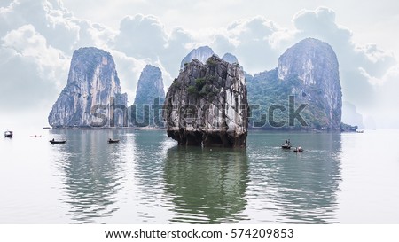 Tourist junks floating among limestone rocks at Ha Long Bay, South China Sea, Vietnam, Southeast Asia