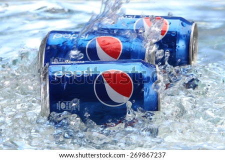 kuala Lumpur,Malaysia 15th April 2015,Can of Pepsi cola on a bed of ice and white background, Pepsi is a carbonated soft drink produced PepsiCo. Created in 1893