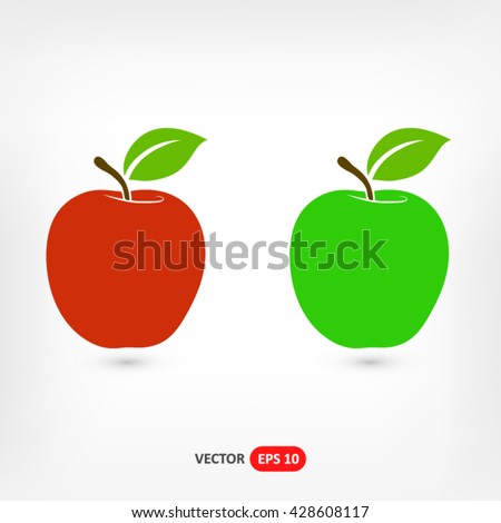 Red and green apples on a gray background