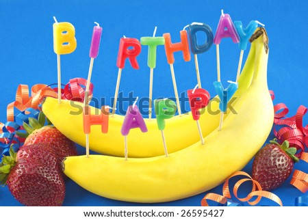 stock-photo-candles-spelling-happy-birthday-stuck-in-bananas-instead-of-cake-for-healthy-lifestyle-birthday-26595427.jpg