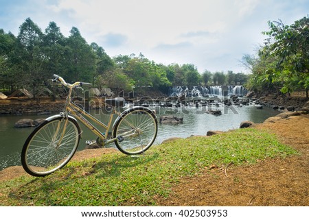 DONG NAI, VIETNAM March 16 2016: Beautiful Waterfall behide my bicycle at GiangDien Waterfall, Dong Nai province, Vietnam in a daytime