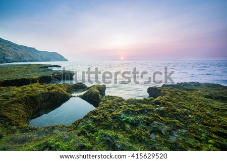 Wonderful dawn in calm waves with ancient coral rocks at Nui Chua national park, Ninh Thuan Province, Viet Nam, one of amazing landscape in Vietnam, masterpiece place for travel.