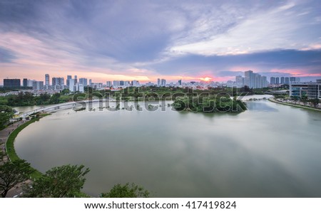 Beautiful sunset over Ban Nguyet Lake with starlight bridge by the weekend, the central of Phu My Hung, District 7 (new urban/city area Ho Chi Minh City, Vietnam)