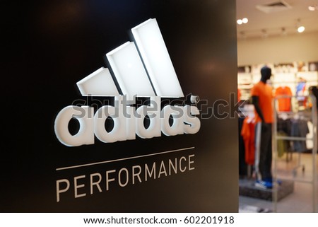 PENANG, MALAYSIA - 12 MARCH 2017: A sign for an Adidas retail store in Queensbay Mall Penang, Adidas is a German corporation that designs footwear and clothing.