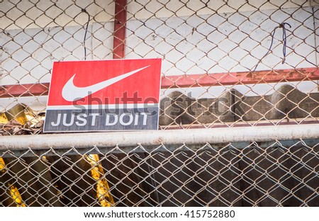 BANGKOK - MAY 3 : "JUST DO IT" Nike logo printed on old wood label. Nike one of famous sport fashion brand worldwide on May 3, 2016 in Bangkok, Thailand.