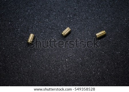 bullet shells ground. Cases of bullets lying on the floor of asphalt