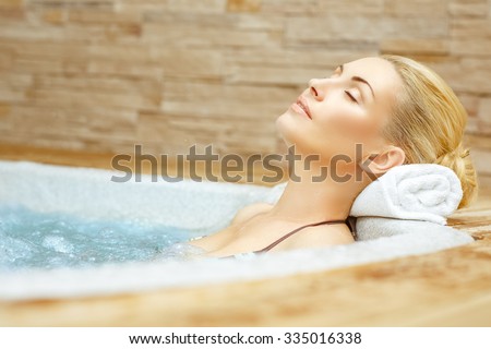 Beauty needs rest. Horizontal shot of a woman enjoying her time in the Jacuzzi with her eyes closed