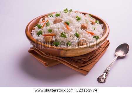 Yummy soya pulao or pilav or pulav or rice or soyabean chunk fried rice with peas and beans, indian or pakistani cuisine