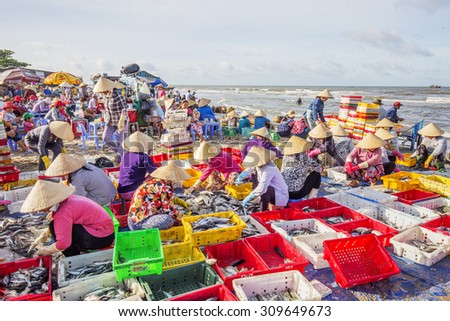 VUNG TAU, VIETNAM - AUG 23,2015: Fishermen on beach at the Fishing Village Long Hai, Vietnam.