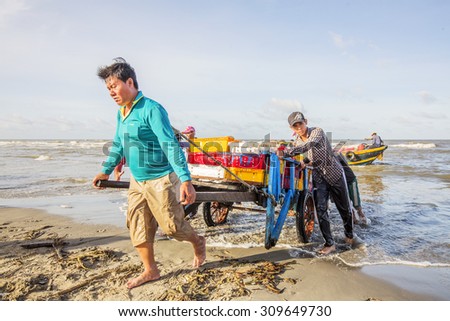 VUNG TAU, VIETNAM - AUG 23,2015: Fishermen on beach at the Fishing Village Long Hai, Vietnam.