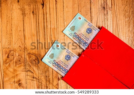 Habit, custom of Vietnamese on Tet is lucky money, a Vietnam traditional culture, child wish somebody a happy new year, receive red envelope with new small change, Tet on spring, also lunar new year