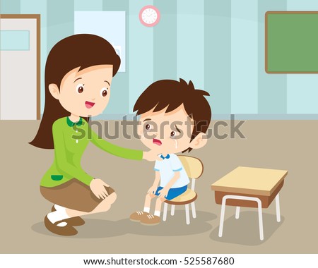 Teacher Comforting Upset Elementary School Pupil.teacher comforting crying preschool boy.