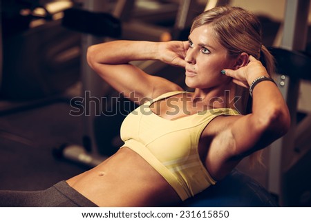 beautiful athletic woman working ab intervals