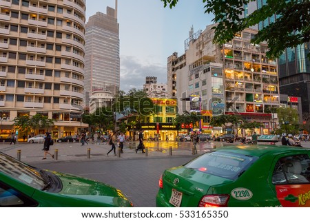 HO CHI MINH - NOVEMBER 29: Nguyen Hue Street in evening on November 29, 2016 in Ho Chi Minh, Vietnam. Vietnamese people (unidentified) walk in Saigon at night.