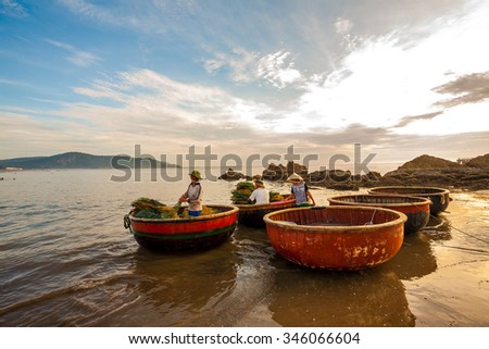 Nghe An, Vietnam: the daily work of fishermen in an e?ly morning at Cua Lo Beach in June 14, 2015. Fishing and tourism are developed together. Here is the famous beaches of Vietnam