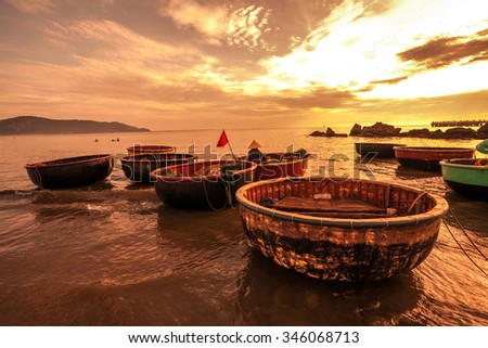 an early morning inn the beach with traditional boat