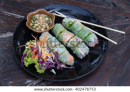 Fresh Vietnamese spring rolls on a plate with salad
