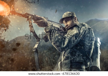 Close-up of man shooting with machine gun