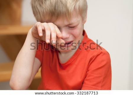 Boy cries of resentment and grief