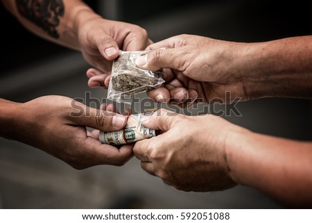 Drug addict buying narcotics and paying