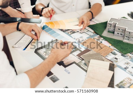 Close up hands of professional architects discussing the project
