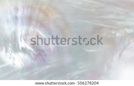 Abstract pearl background with shimmering mother of pearl lilac and rainbow colours