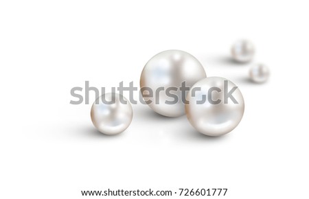 Pearl background on white - White pearls in foreground and two in background with diminishing depth of field. Space for text