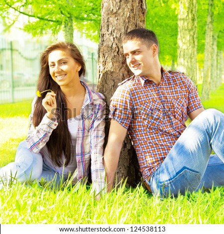https://thumb1.shutterstock.com/display_pic_with_logo/360472/124538113/stock-photo--portrait-of-young-latin-hispanic-romantic-couple-sitting-in-forest-enjoying-themselves-outdoor-124538113.jpg