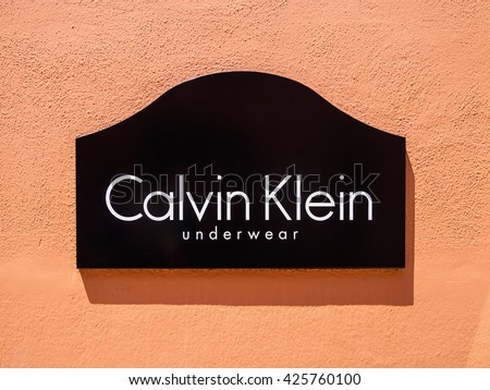 LA ROCA VILLAGE, BARCELONA, CATALONIA, SPAIN - MAY 2016 : silkscreen poster with the Calvin Klein logo, brand outside the official store