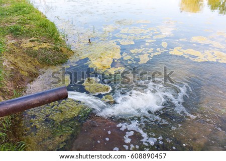 From the pipe water flows into the river, the lake, the sea. Environmental pollution, ecological catastrophe