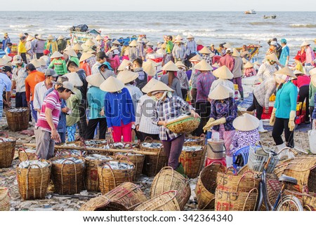 VUNG TAU, VIETNAM - AUG 22,2015: Fishermen on beach at the Fishing Village Long Hai, Vietnam