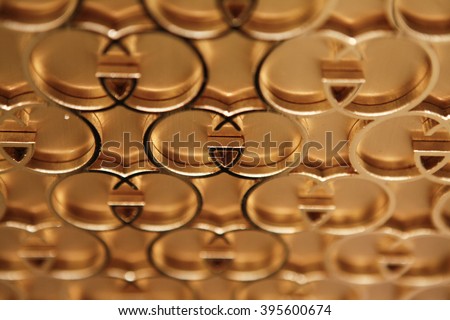 ROME, ITALY - 19 NOVEMBER 2012: Interlocking "G" Gucci logos form a display on a wall inside a Gucci store.