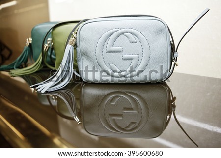 ROME, ITALY - 19 NOVEMBER 2012: A row of Gucci 'Soho' bags bearing the interlocking "G" logo are displayed for sale inside a Gucci store.