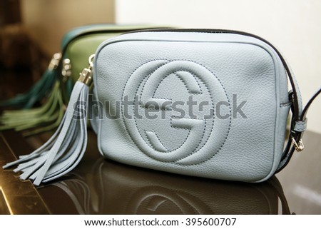ROME, ITALY - 19 NOVEMBER 2012: A row of Gucci 'Soho' bags bearing the interlocking "G" logo are displayed for sale inside a Gucci store.