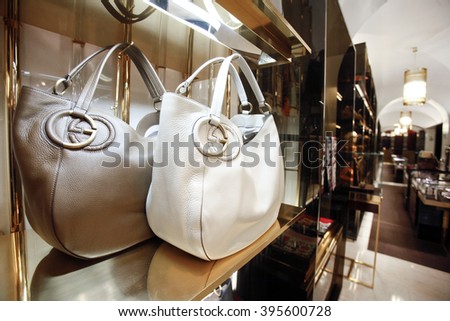 ROME, ITALY - 19 NOVEMBER 2012: A pair of Gucci 'Twill' bags bearing the interlocking "G" logo sit displayed for sale inside a Gucci store.