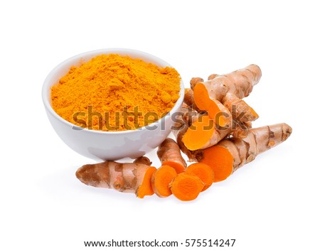 Turmeric roots and turmeric powder in white bowl isolated on white background