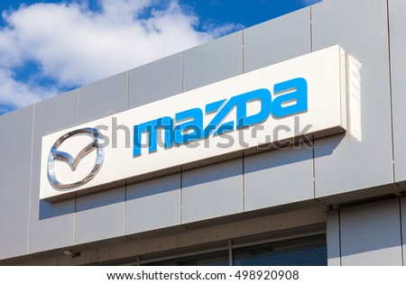 SAMARA, RUSSIA - MAY 11, 2016: Mazda logo on the facade of official dealer office. Mazda Motor Corporation is a Japanese car brand, automotive manufacturer