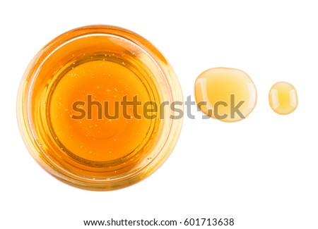 Pure honey in glass bowl and honey stain.