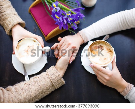 http://thumb1.shutterstock.com/display_pic_with_logo/3673592/377893090/stock-photo-couple-in-love-holding-hands-in-a-cafe-woman-and-man-drinking-coffee-and-gently-hold-hands-top-377893090.jpg